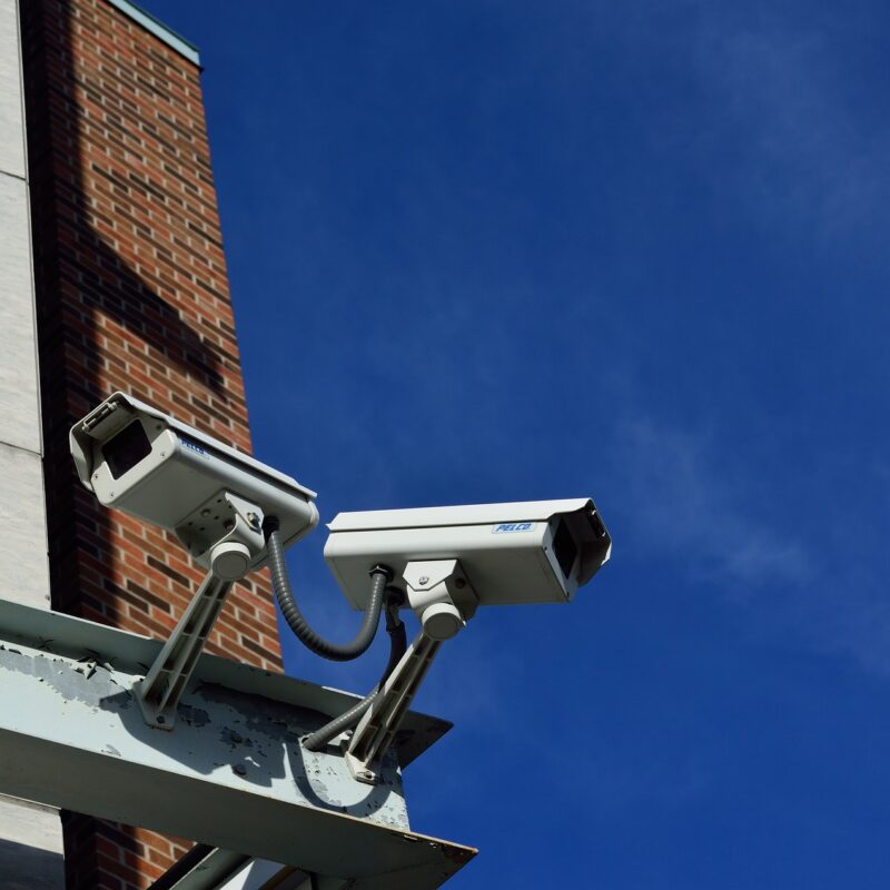 A close up of two CCTV cameras, part of an electrical installation in London