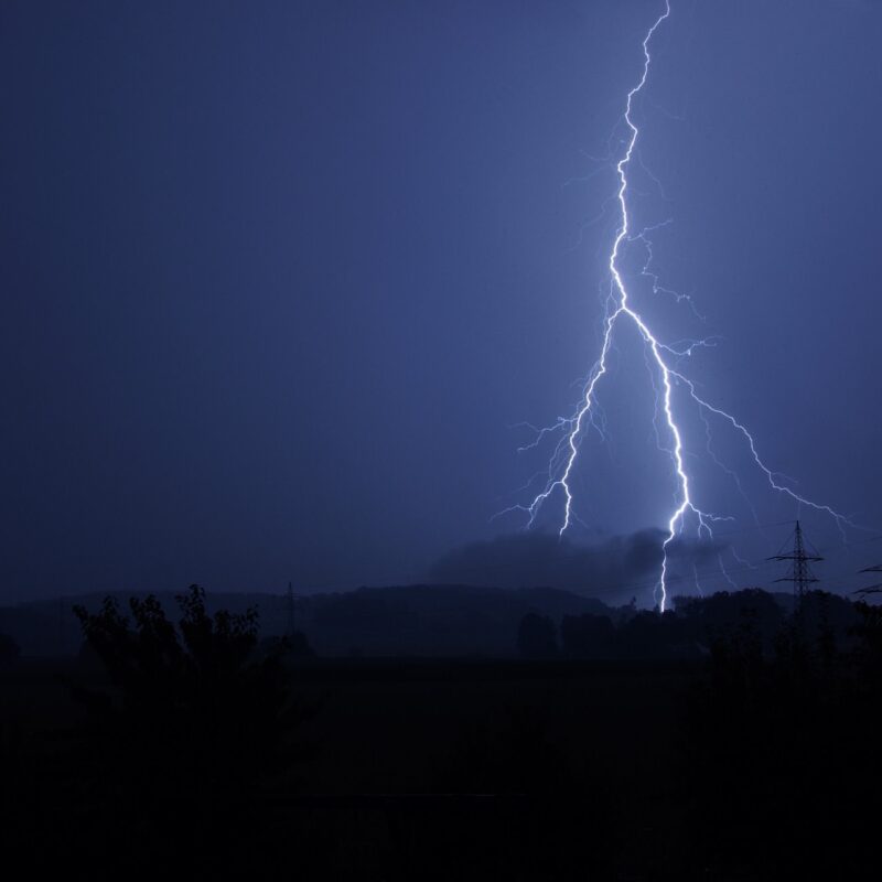 A picture showing a sky during a storm with lightning that has caused an electrical power cut