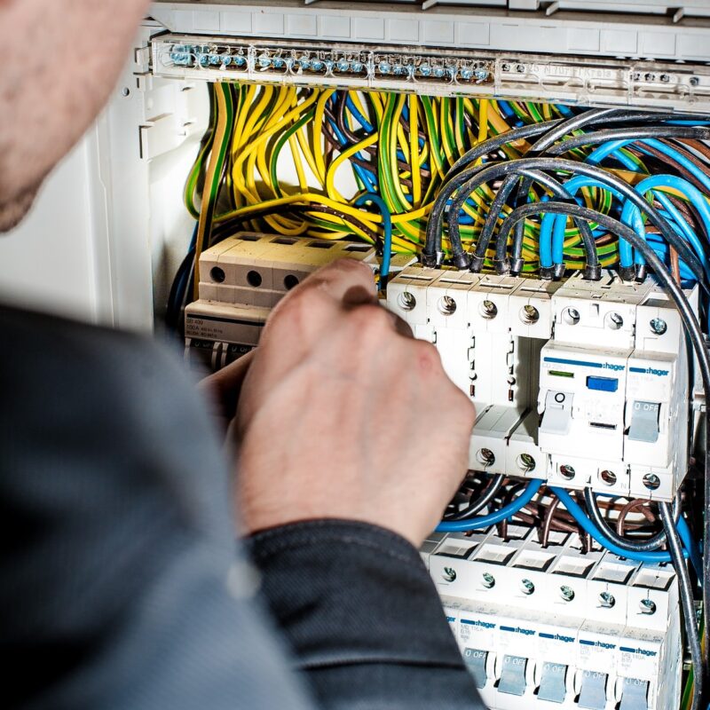 An electrician working with precision - one of the fundamental traits required to become an electrician